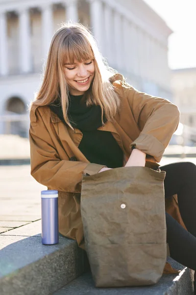 Attractive Blonde Student Girl Orange Trench Using Lunchbox Student Manager — Stock Photo, Image