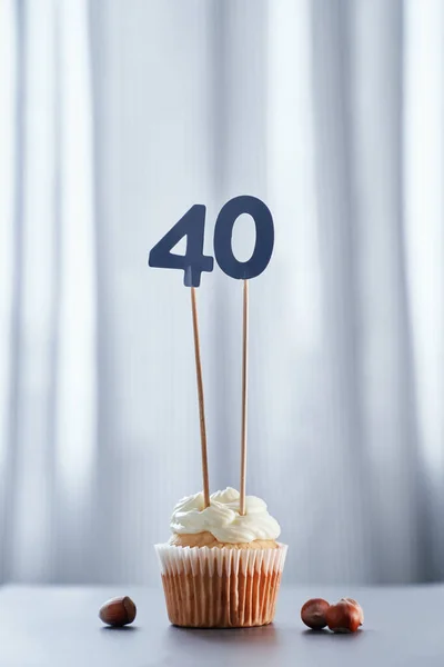 Minimalistic anniversary birthday cake with number 40 forty