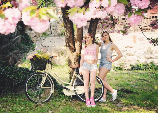 Girls in spring garden — Stock Photo, Image