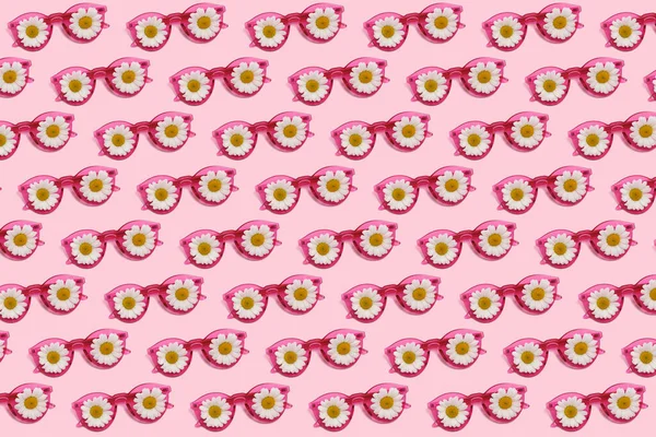 Pattern of pink glasses with daisies