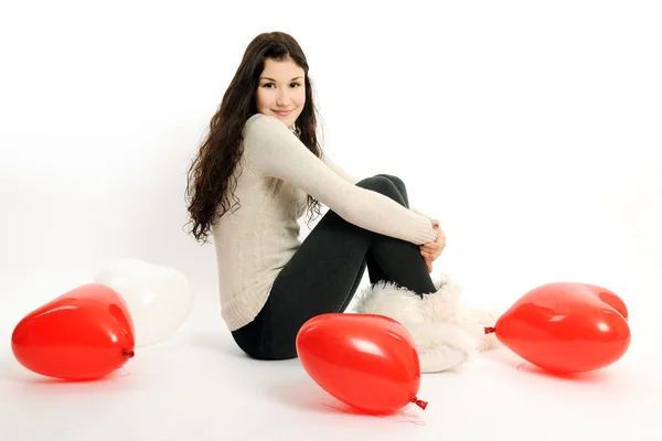 Mädchen mit roten Luftballons — Stockfoto