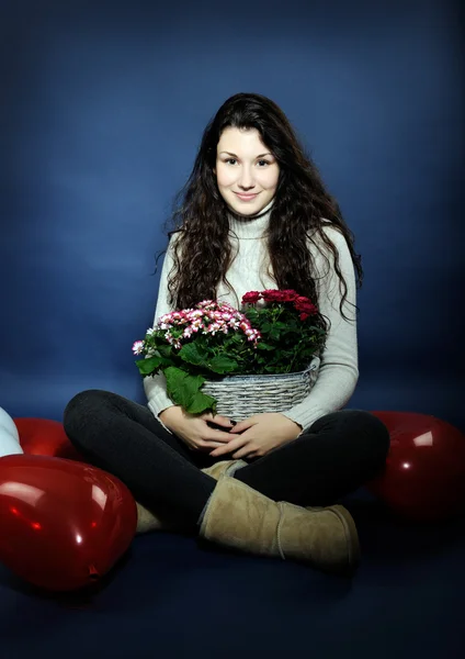 Beautiful girl with flowers — Stock Photo, Image