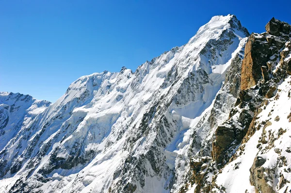 Snowy mountains peak Stock Image