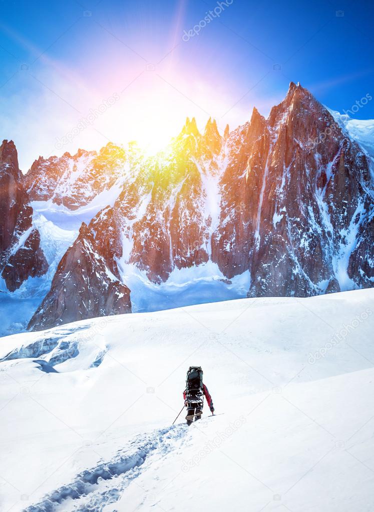 Tourist with a backpack and mountain panorama. 