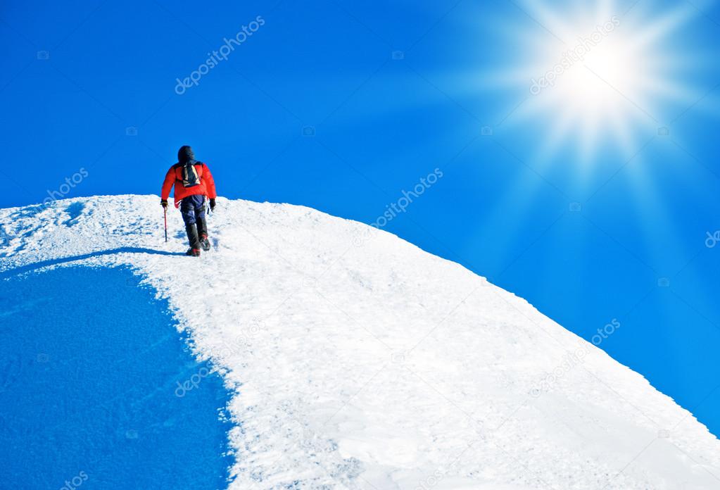 A climber reaching the summit