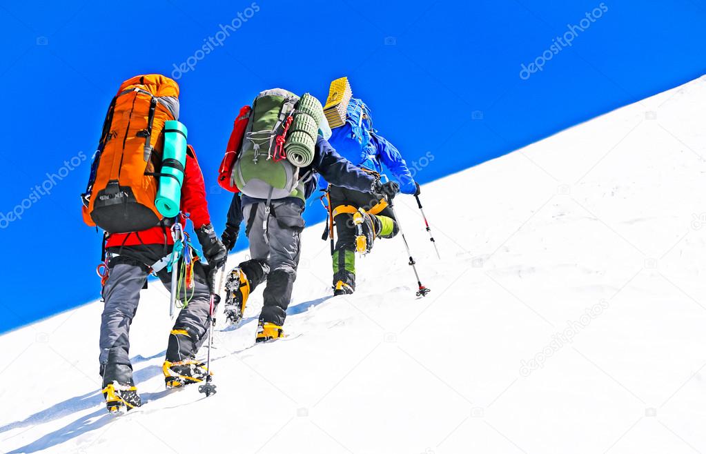 Group of  climbers reaching the summit