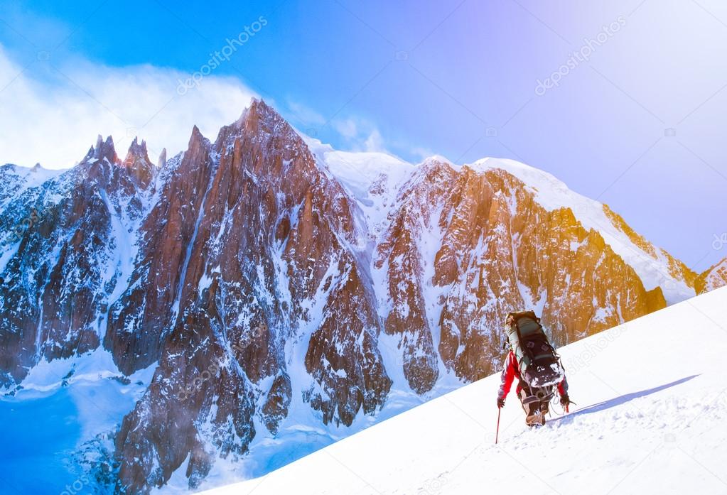 Group of climbers reaching the summit