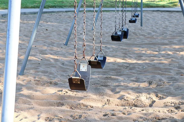 Seats on a swingset at the park — Stock Photo, Image