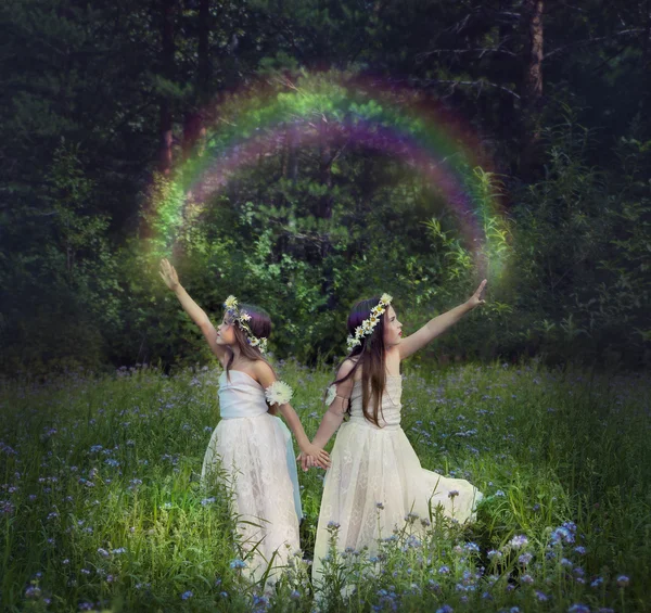 Photo manipulation with young girls who make a rainbow — Stock Photo, Image