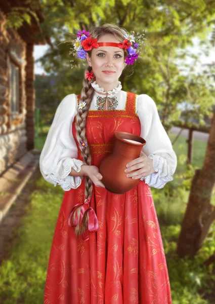 Menina com um jarro de leite — Fotografia de Stock