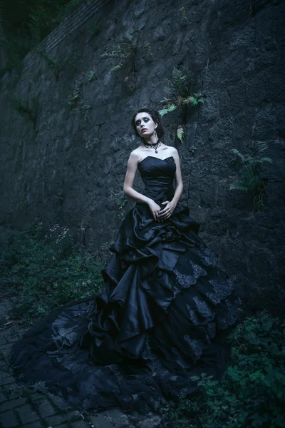 Attractive woman in black dress — Stock Photo, Image