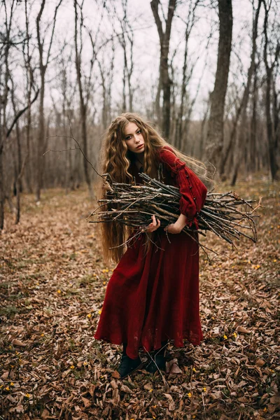 Young witch in the autumn forest — Stock Photo, Image