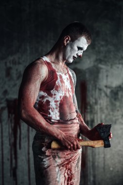 Bloody clown-maniac with ax clipart