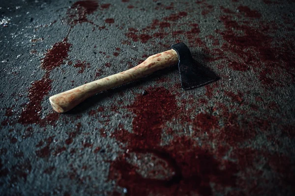 Bloody ax lying on the floor — Stock Photo, Image