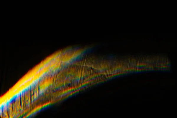 Abstrato borrado bokeh flare lente colorida no preto — Fotografia de Stock