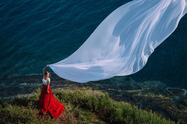 Beautiful Girl With White fabric on sea background — Stock Photo, Image