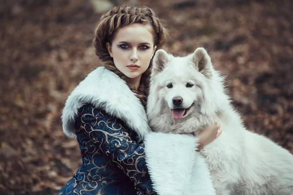 The woman on winter walk with a dog — Stock Photo, Image