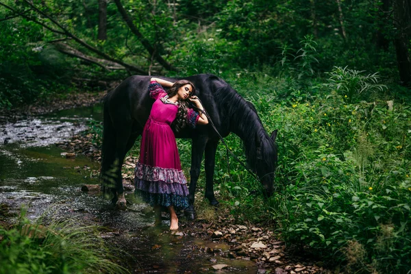 Beautiful gypsy in violet dress — Stock Photo, Image