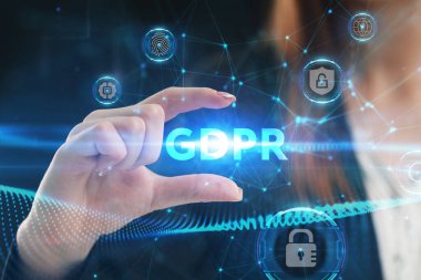 İş, Teknoloji, İnternet ve ağ konsepti. Genç işadamı geleceğin sanal ekranı üzerinde çalışıyor ve GDPR yazısını görüyor.