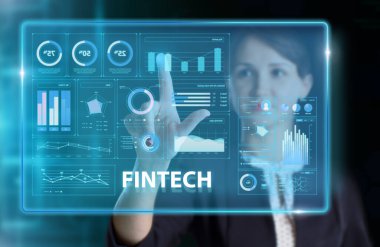 İş, Teknoloji, İnternet ve ağ konsepti. Genç işadamı geleceğin sanal ekranı üzerinde çalışıyor ve Fintech yazısını görüyor.