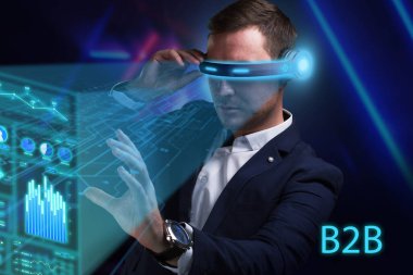 İş, Teknoloji, İnternet ve ağ konsepti. Genç işadamı geleceğin sanal ekranı üzerinde çalışıyor ve B2B yazısını görüyor.