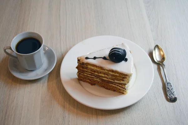 Piece of white chocolate cake on a saucer — Stock Photo, Image