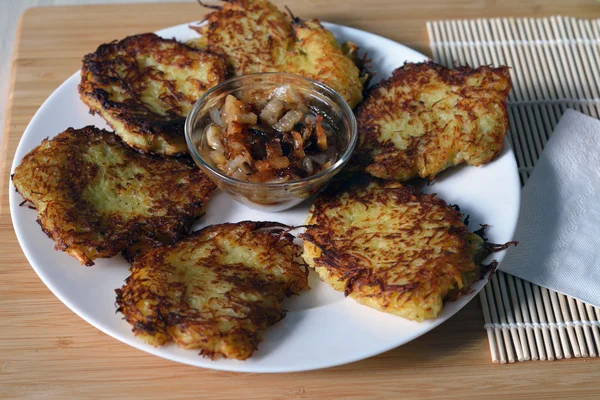 Potato pancakes with lard and fried onion — Stock Photo, Image