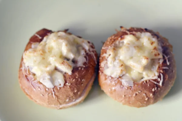 Julienne in a bun topped with cheese — Stock Photo, Image