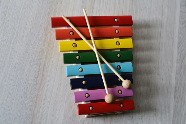 Multicored xylophone with crossed sticks — Stock Photo, Image