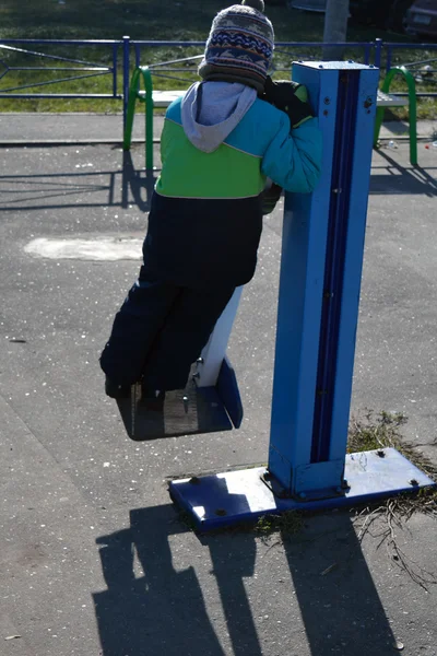 A boy swirling and doing fitness outdoors — Stock Photo, Image