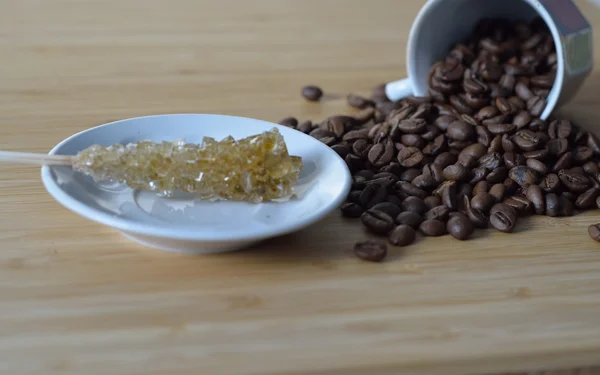 Sugar stick and coffee beans — Stock Photo, Image