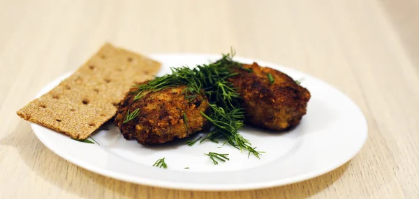 Fried meatballs with rye crisps and dill — Stock Photo, Image