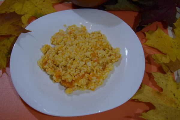 Sweet dessert pumpkin porridge, with milk and millet — Stock Photo, Image