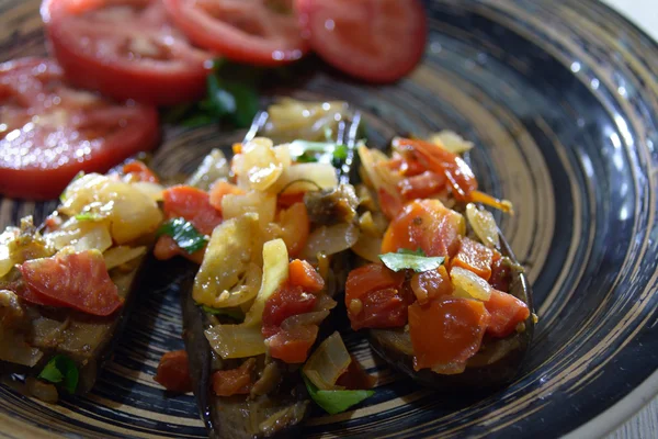 Imam bayildi eggplant on the plate, with tomatoes — Stock Photo, Image