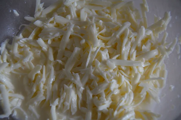 Grated suluguni cheese in a bowl — Stock Photo, Image