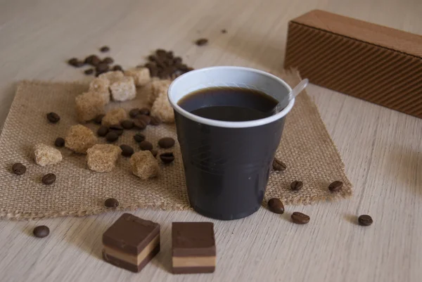 Black coffee in a cup on the table — Stock Photo, Image