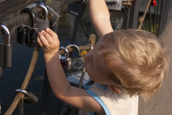 A boy exploring the locks — Stock Photo, Image