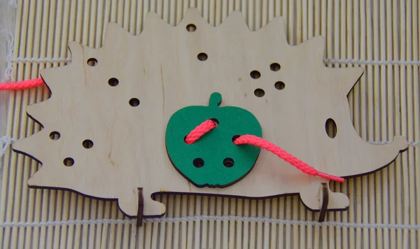 Wooden lacing in the fowm of a hedgehog — Stock Photo, Image