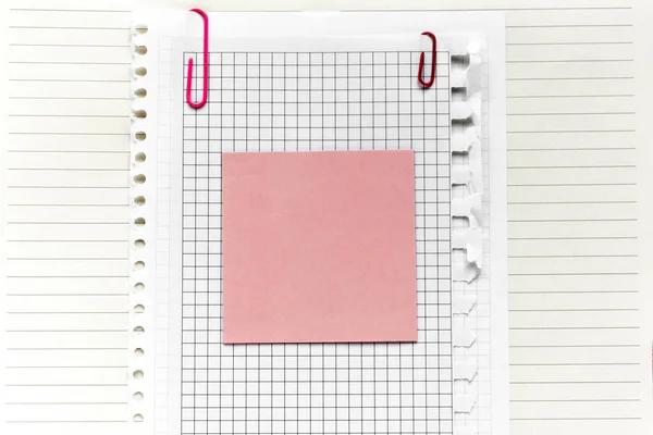 Pink sticker on the paper sheets. Template with copy space for your text