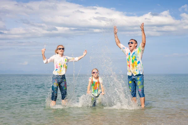 Happy family playing on the beach at the day time. — Stock Photo, Image