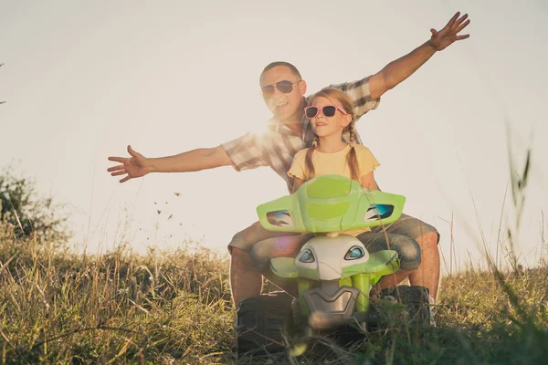 Father and daughter playing on the road at the day time. — Stock Photo, Image