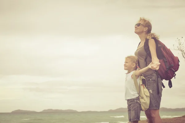 Happy family standing on the beach at the day time. — Stock Photo, Image