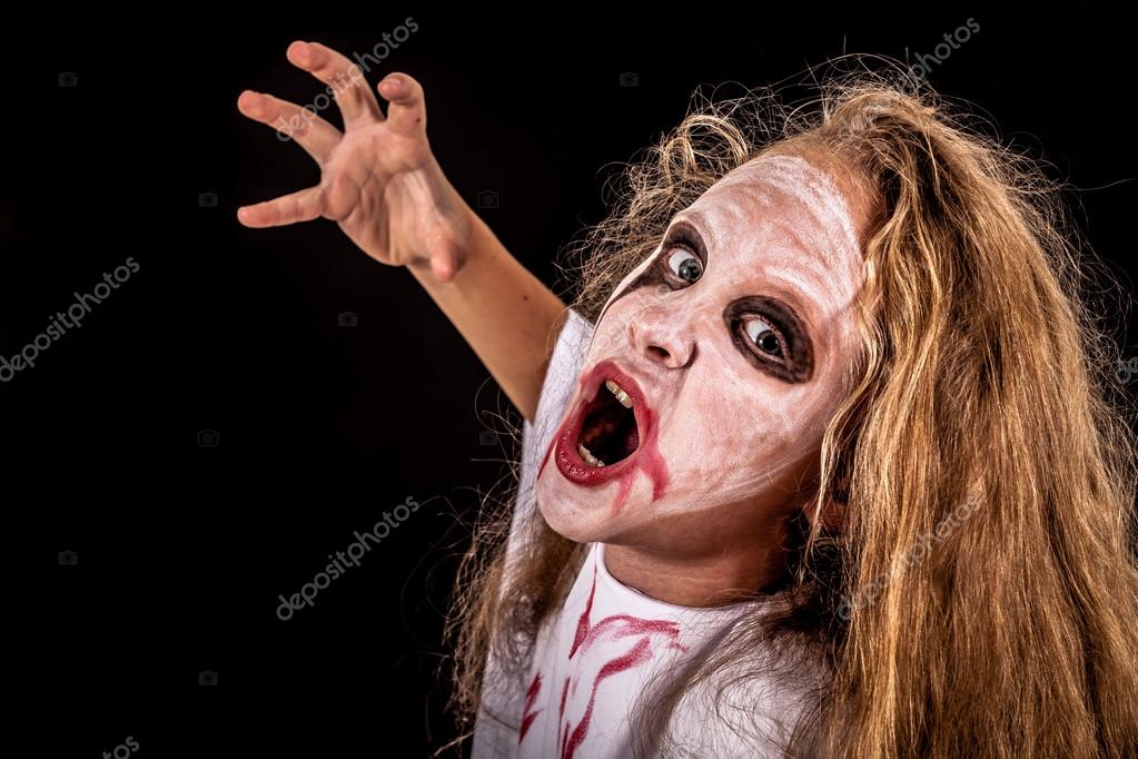 Teen girl in costume zombi. Concept of death on Halloween party