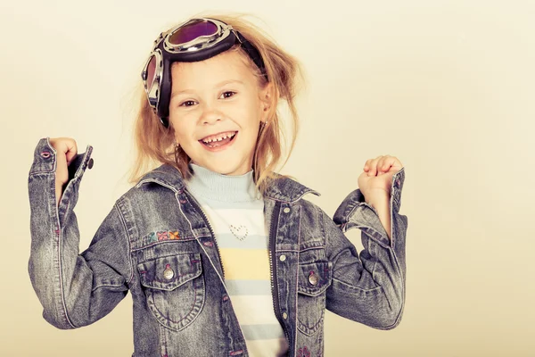 Portrait of a little girl in a denim jacket — Stock Photo, Image