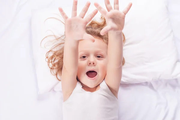 Lovely little boy lying in bed at home — Stock Photo, Image