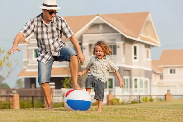Father and son playing on the grass — Stock Photo, Image