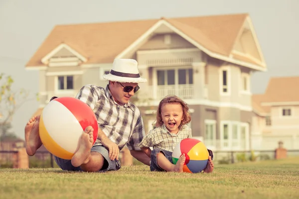 Father and son playing on the grass — Stock Photo, Image