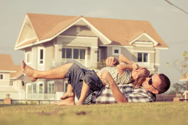 Father and son playing on the grass — Stock Photo, Image