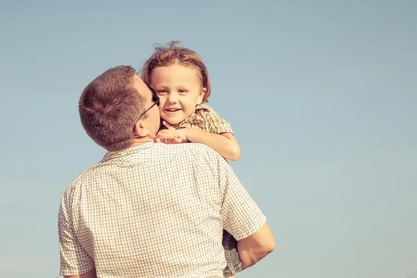 Dad and son playing near a house — Stock Photo, Image