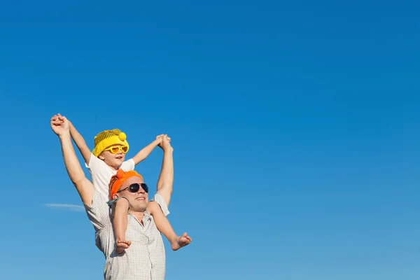 Father and little son playing near a house — Stock Photo, Image